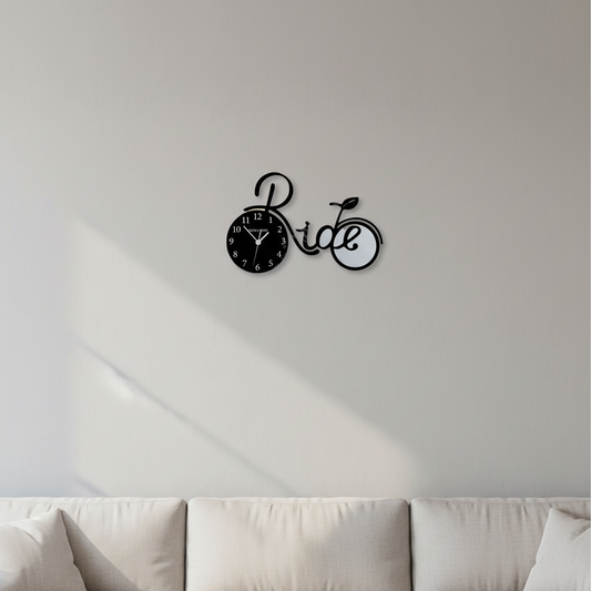Bicycle-shaped clock with 'Ride' text on a white background