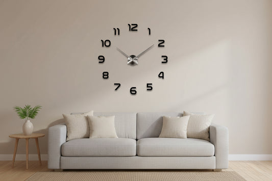 Large wall clock with black numbers and silver hands in a living room setting.