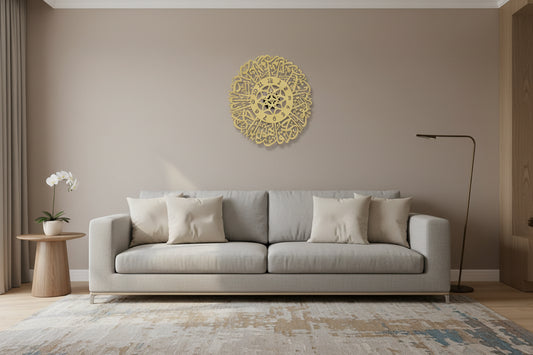 Decorative gold clock with intricate designs on a marble surface