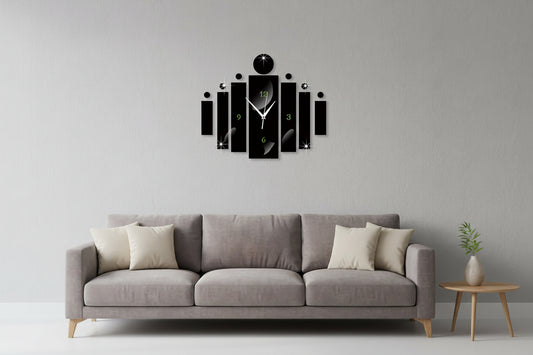 Modern wall clock with black and white design on a green wall